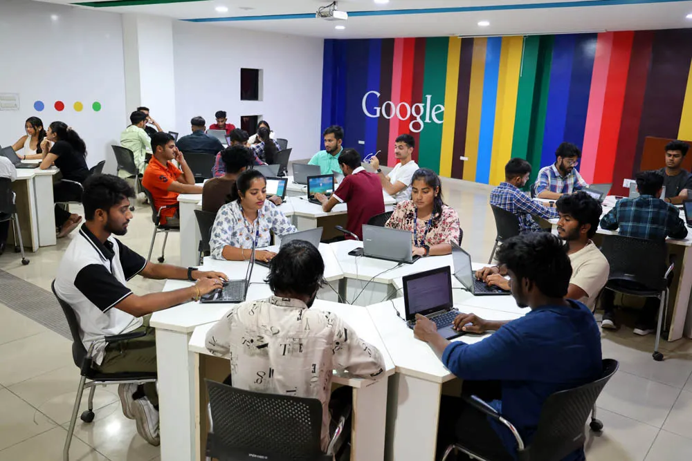 Students working on laptops in a computer lab at LPU