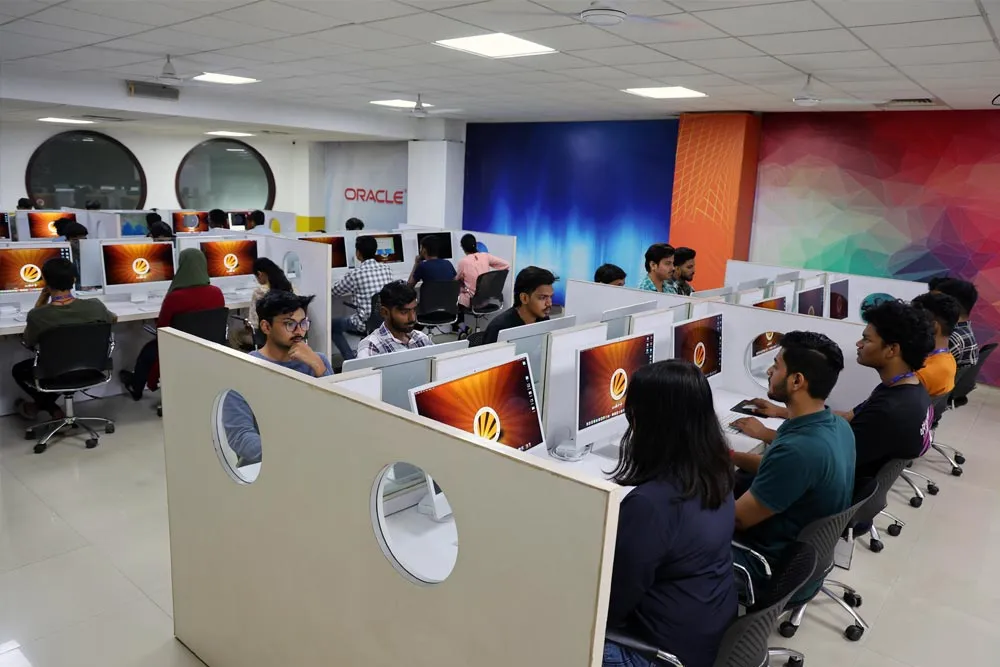 Students at rows of iMacs in an LPU computer lab
